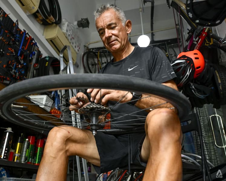 Once a banking high-flyer, this expat repairs bikes for free for migrant workers and others in need