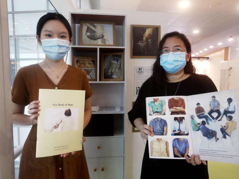 Yang Kaiwen (right) and Foo Choon Ean with the picture book they created to showcase Ms Foo’s OCD, entitled Our Book of Hope, at the Mental Health Collective SG Exhibition on Dec 19, 2021. Yang Kaiwen (right) and Foo Choon Ean with the picture book they created to showcase Ms Foo’s OCD, entitled Our Book of Hope, at the Mental Health Collective SG Exhibition on Dec 19, 2021.
