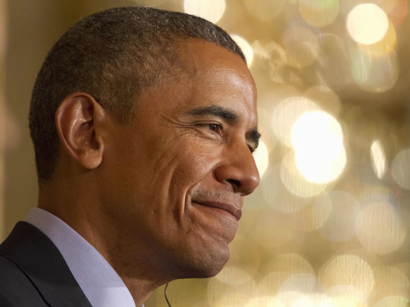 President Barack Obama smiles during a news conference. Photo: AP