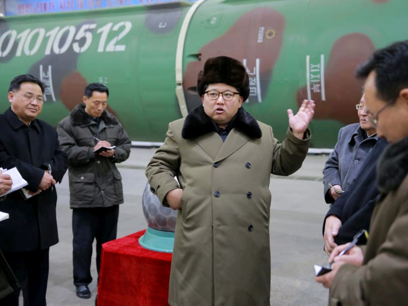 North Korean leader Kim Jong Un meets scientists and technicians in the field of research into nuclear weapons in this undated photo released by North Korea's Korean Central News Agency (KCNA) in Pyongyang on  March 9, 2016. Photo: KCNA via Reuters