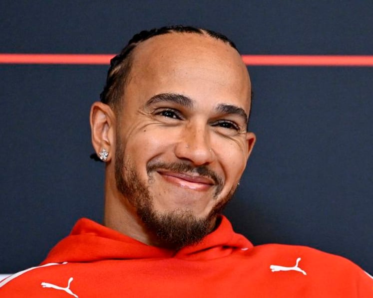 Hamilton sheds tear over Arsenal title as drivers swap lap times for football talk