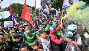 Ride-hailing drivers in Indonesia hold protests to demand better pay