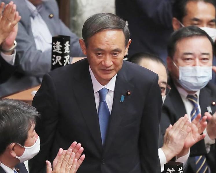 Japan's populist, pragmatic new PM Suga pushes Abe's vision