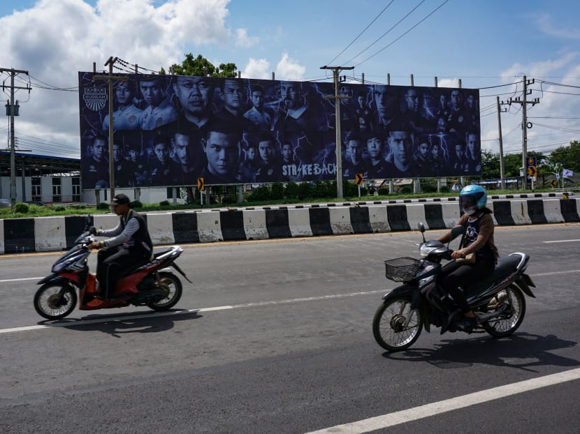 A billboard showing 58-year-old former Thai MP, Newin Chidchob (third from left), and Buriram United football players pictured on a giant billboard in the north-eastern Thai province of Buriram. A 'godfather' of Thai politics is using cash and contacts to transform his once poor, forgotten rice-farming fiefdom into an unlikely sporting Camelot, complete with a football stadium and racetrack. Photo: AFP