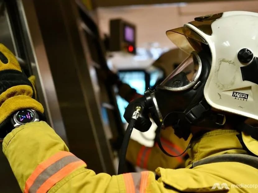 Singapore Civil Defence Force officer cadets wearing the smart watch while climbing the "endless ladder".