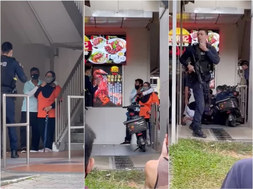 Screenshots of videos posted on Facebook of Mohamed Faizal Mohamed Ariff holding a woman hostage at knifepoint in a standoff with 10 police officers in Yishun. Screenshots of videos posted on Facebook of Mohamed Faizal Mohamed Ariff holding a woman hostage at knifepoint in a standoff with 10 police officers in Yishun.