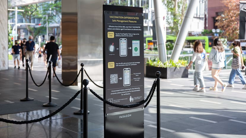 Covid-19 rules, use of TraceTogether, SafeEntry to be reviewed but not with hospitals still 'very busy': Ong Ye Kung