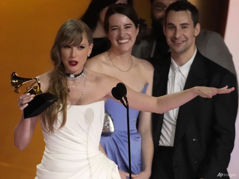 Taylor Swift wins album of the year at the Grammy Awards for fourth time, setting a new record