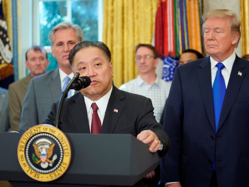 Mr Hock Tan, chief executive of Broadcom, speaking after US President Donald Trump said the Singapore-based company will bring its headquarters back to the US, in the Oval Office of the White House in Washington, on Nov 2, 2017. Photo: Reuters