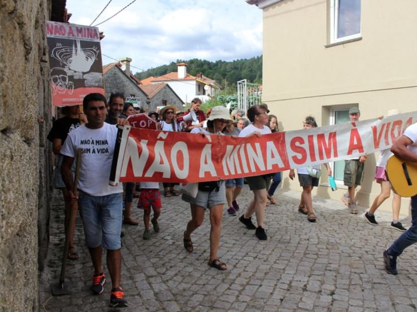 FILE PHOTO: People carrying a banner saying "No to the mine. Yes to life" take part in a anti-lithium protest in Covas do Barroso, Portugal, August 15, 2023. REUTERS/Catarina Demony/File Photo