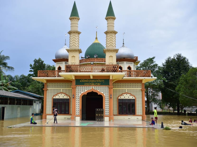 A mosque is seen surrounded by floodwaters following heavy rain in Thailand's southern province of Narathiwat on Dec 26, 2023.