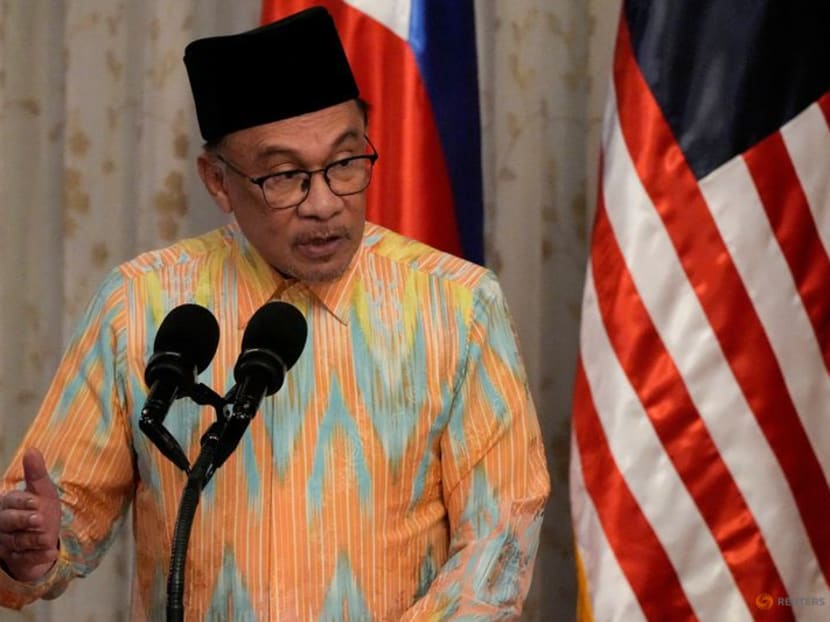 Malaysian Prime Minister Anwar Ibrahim gestures as he delivers his speech during his visit to the Malacanang palace, in Manila, Philippines, on March 1, 2023.