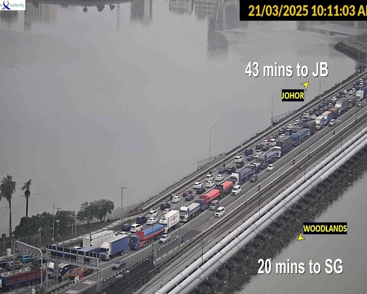 Travellers advised to defer non-essential travel to Johor as heavy rain worsens traffic at land checkpoints