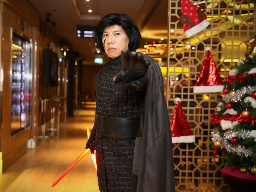Star Wars fan Mr Alex Low, dressed as Kylo Ren, poses for a photo at Suntec City. Mr Low booked an entire 170-seater Golden Village theatre for a private screening with his friends to watch The Last Jedi together. Photo: Nuria Ling/TODAY