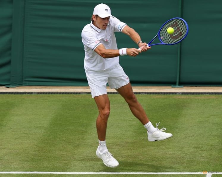 Honorary Brit De Minaur eases into second round