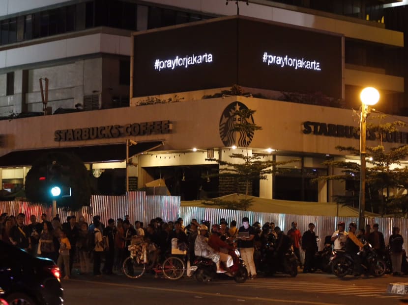 Seven dead in Jakarta blasts, gunfight