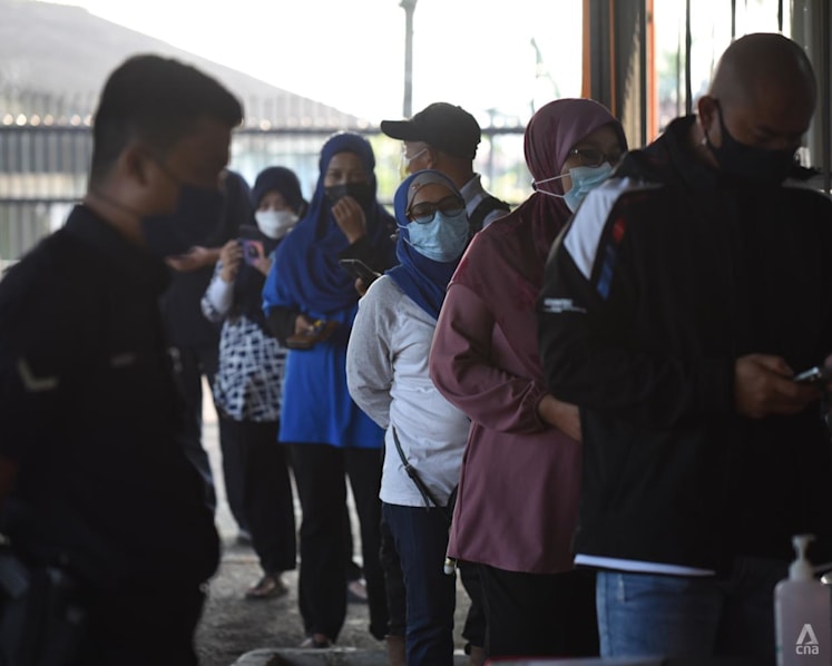 Johor state election: Voters cast their ballots on polling day amid tight COVID-19 protocols 