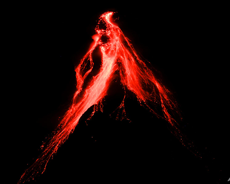 Philippines' Mayon Volcano spews lava down its slopes in gentle eruption, putting thousands on alert