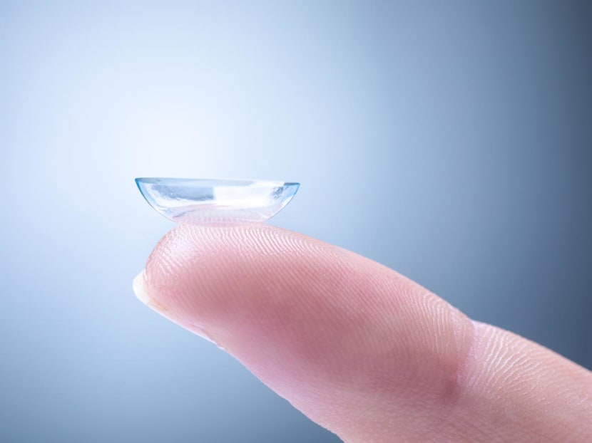 What are multifocal contact lenses and how do they correct presbyopia? 