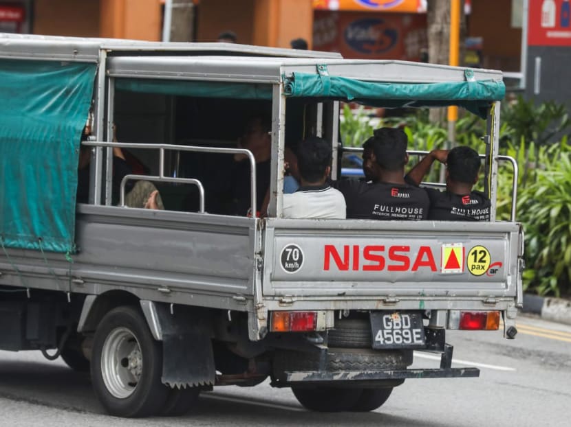 Workers being transported on the back of a lorry on Oct 22, 2022.