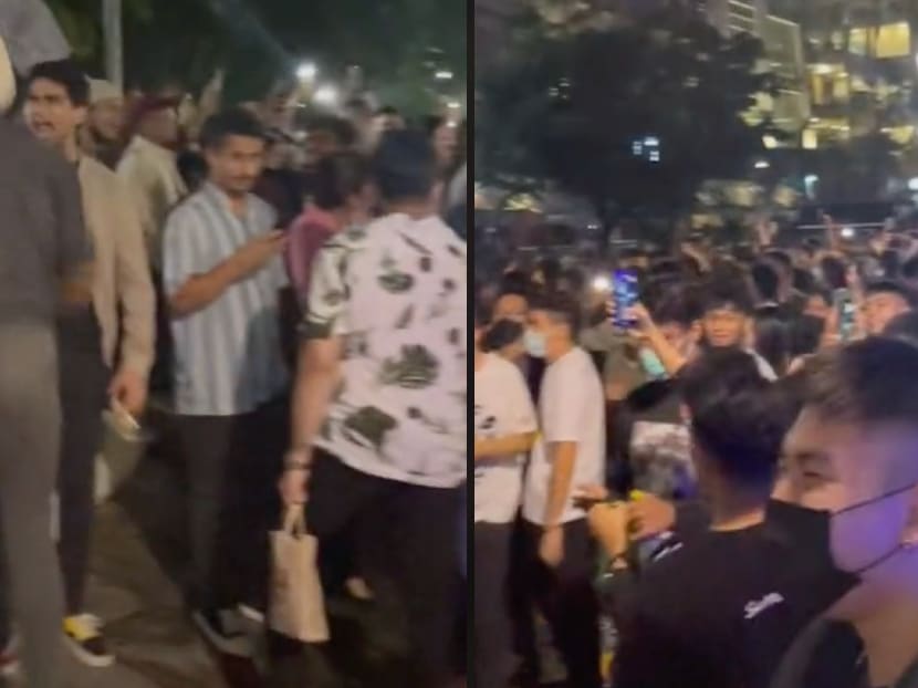 Screenshots from videos taken at an impromptu New Year’s Eve gathering at Clarke Quay on Dec 31, 2021. 
