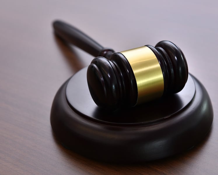 Woman charged after Internet love scam victims transfer money to her bank account