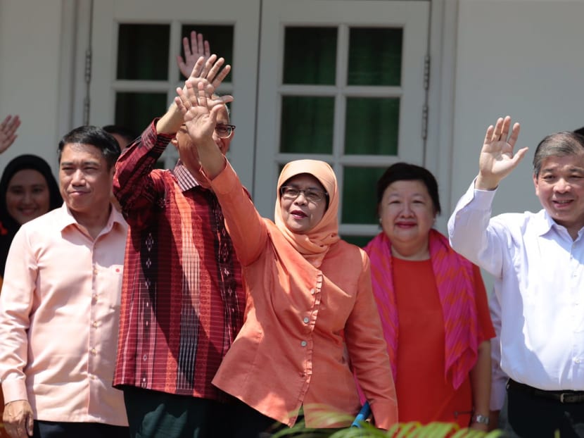 Mdm Halimah Yacob (centre, in orange) at the Nomination Centre on Sept 13, 2017. Photo: Jason Quah