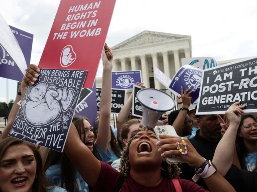 Anti-abortion activists celebrate outside the US Supreme Court on June 24, 2022 after the court overturned the Roe v Wade decision which had given constitutional recognition to women's right to abortion. Pro-choice activists also gathered to oppose the ruling. Anti-abortion activists celebrate outside the US Supreme Court on June 24, 2022 after the court overturned the Roe v Wade decision which had given constitutional recognition to women's right to abortion. Pro-choice activists also gathered to oppose the ruling.