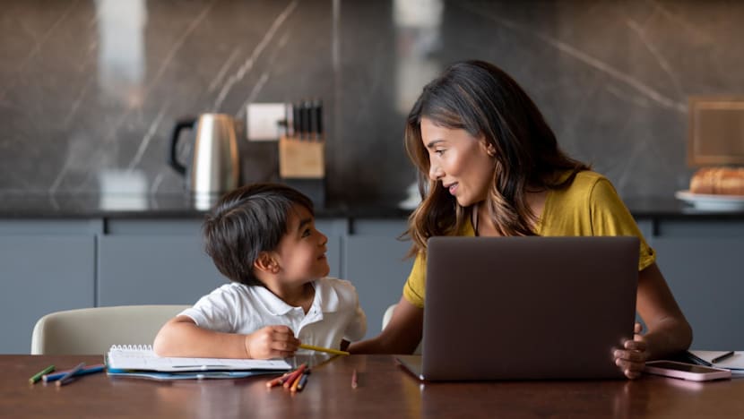 A mother uses AI tools to gather parenting ideas while relying on community support for guidance.