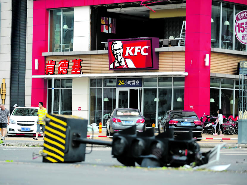 Typhoon damage in Hainan on Saturday. Relief efforts are being reportedly hampered by damage to power and telecommunications networks, ports and roads, and water supplies. PHOTO: XINHUA
