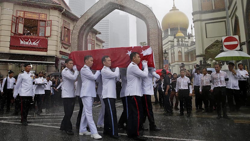 Crowds brave torrential downpour as Othman Wok is laid to rest