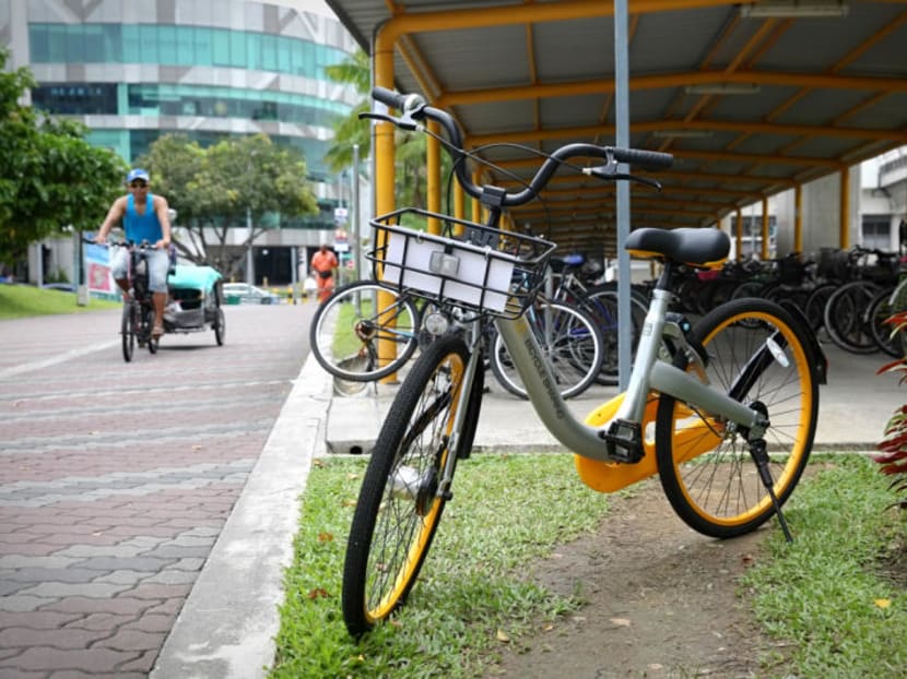 An oBike is seen parked next to a bicycle park at Tampines. TODAY file photo