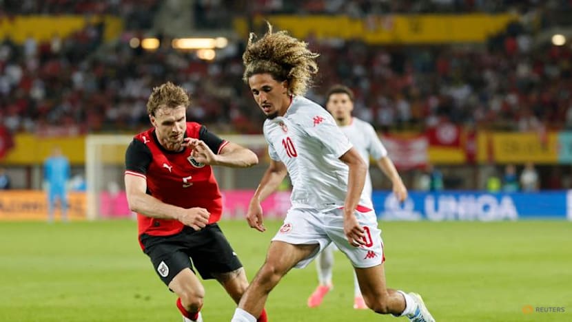 Austria fight back from early red card to beat Tunisia
