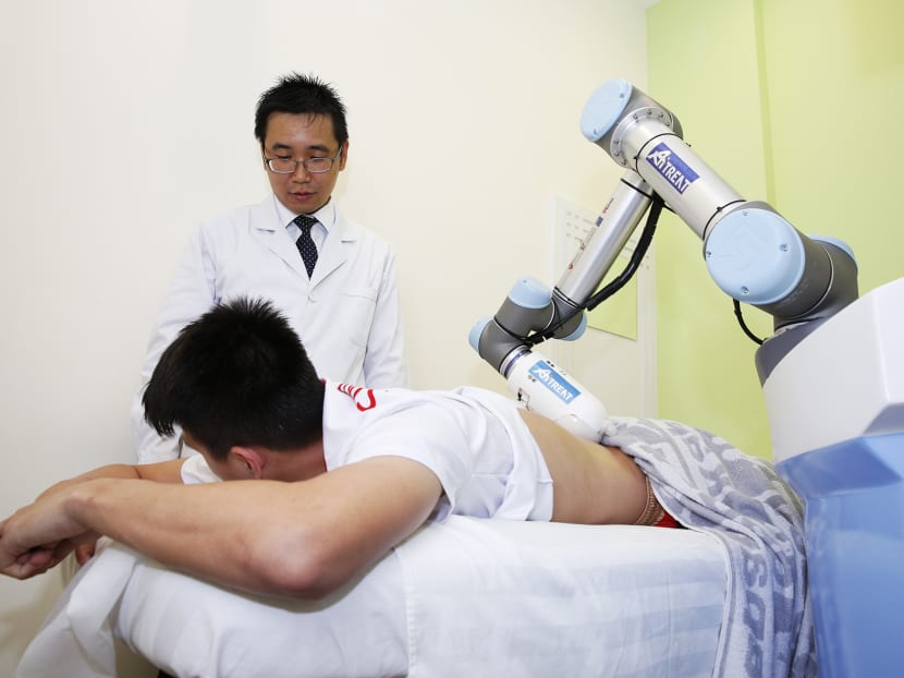 National basketballer Leon Kwek received a massage from "Emma". Photo: Damien Teo/TODAY