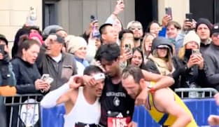 Boston marathon runners praised for giving up personal bests to help exhausted man finish
