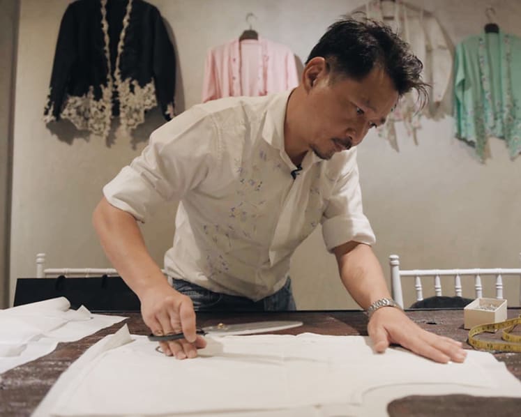 Defiantly, he weaves life into a dying Peranakan craft