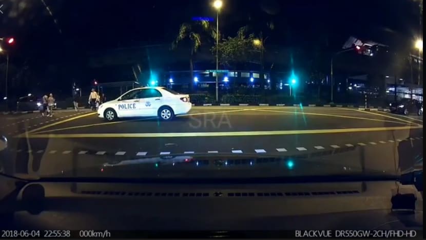 Police officer fined S$200, 12 demerit points for beating red light