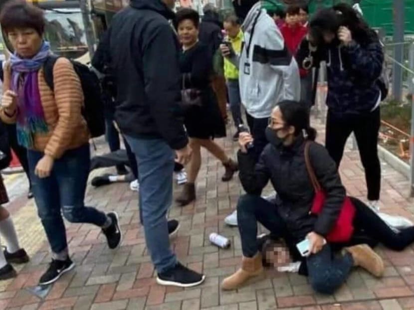 An online photo of a masked policewoman in plain clothes sitting on a 14-year-old schoolgirl has gone viral.