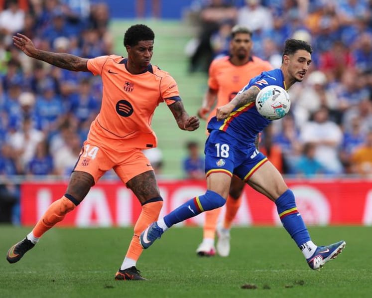 Barcelona march on towards title with 2-0 victory at Getafe