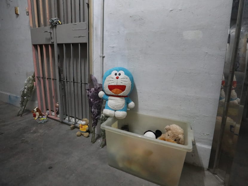 Toys and sweets left outside the Chin Swee Road flat where a toddler was allegedly murdered.
