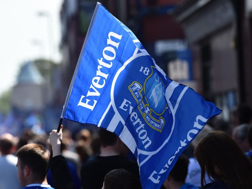 Everton supporters wave the club's flag before the start of the English Premier League football match between Everton and Bournemouth at Goodison Park in Liverpool, north west England on May 28, 2023. Everton supporters wave the club's flag before the start of the English Premier League football match between Everton and Bournemouth at Goodison Park in Liverpool, north west England on May 28, 2023.