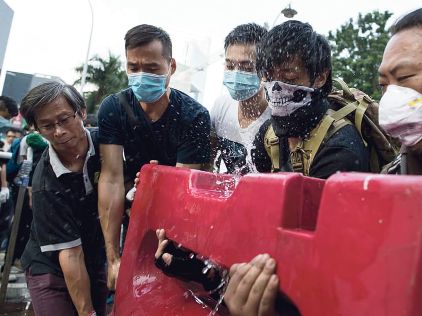 Mobs angry over disruption confront Hong Kong protesters
