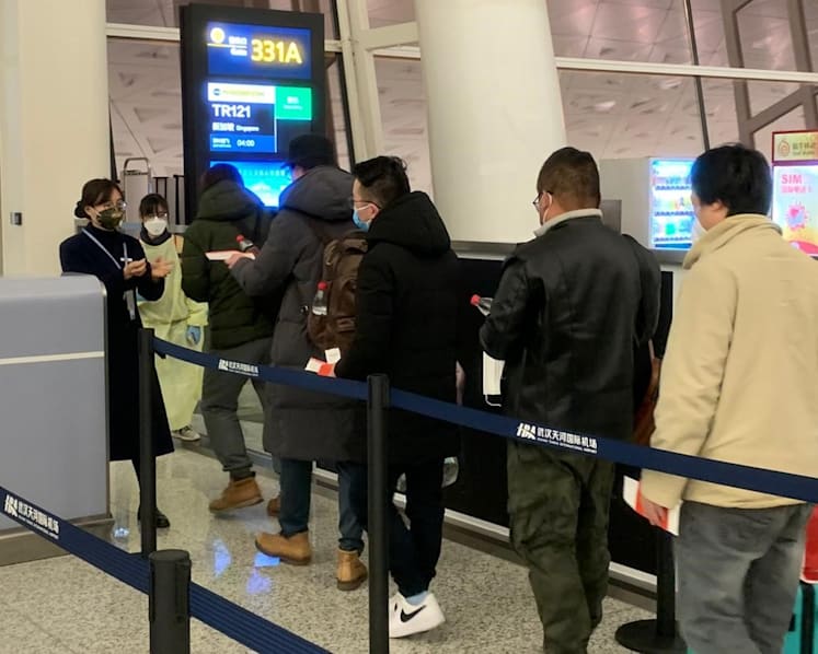 92 Singaporeans return home from Wuhan; 'some' who show symptoms of virus remain behind