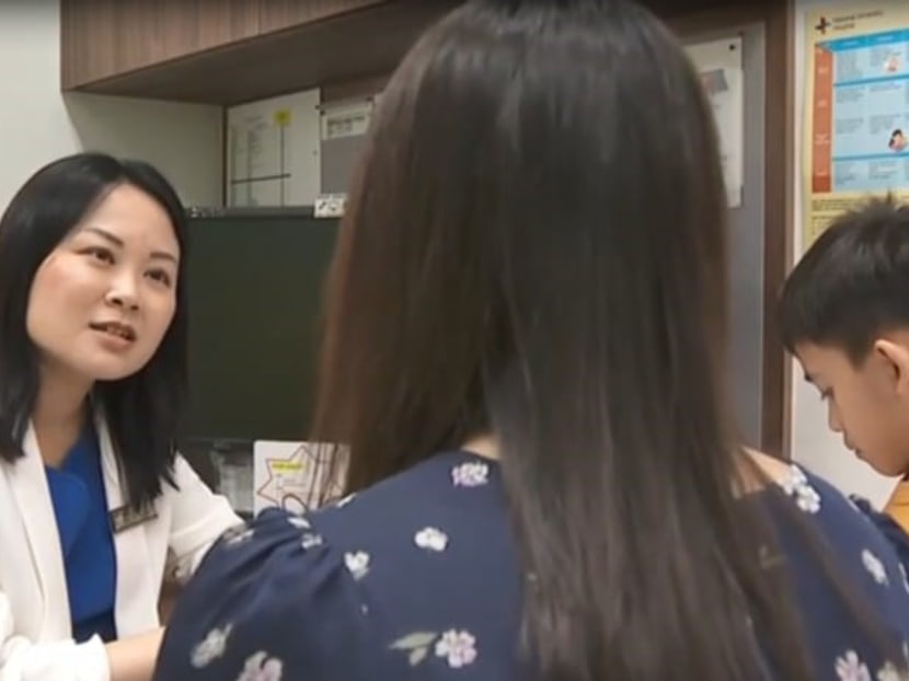 A healthcare professional speaks to a parent about autism. Early detection and intervention are key to improving the effectiveness of treatment and overall quality of life, said doctors.