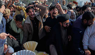 Thousands mourn victims of suicide bombing in Islamabad, as four arrests made