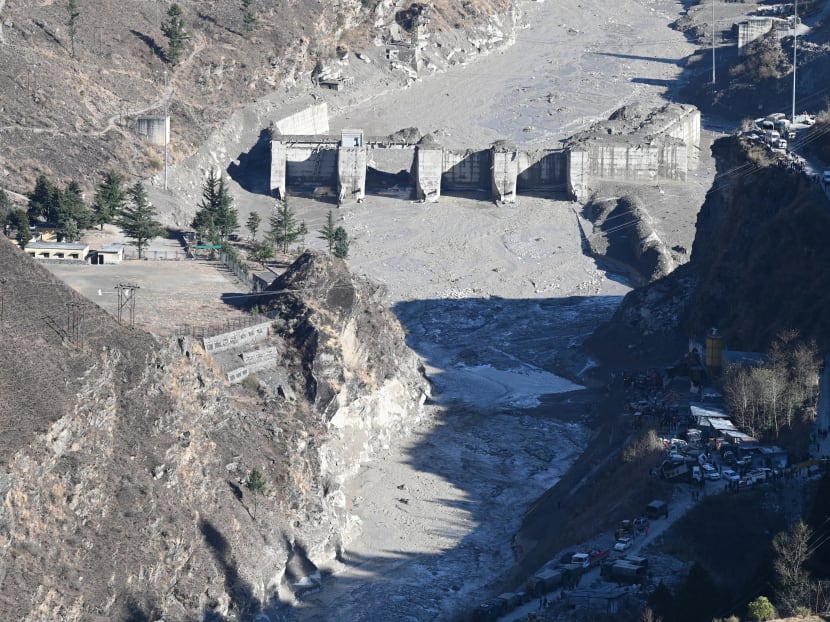 A general view shows the remains of a dam along a river in Tapovan of Chamoli district on February 8, 2021 damaged after a flash flood thought to have been caused when a glacier broke off on February 7. A general view shows the remains of a dam along a river in Tapovan of Chamoli district on February 8, 2021 damaged after a flash flood thought to have been caused when a glacier broke off on February 7.