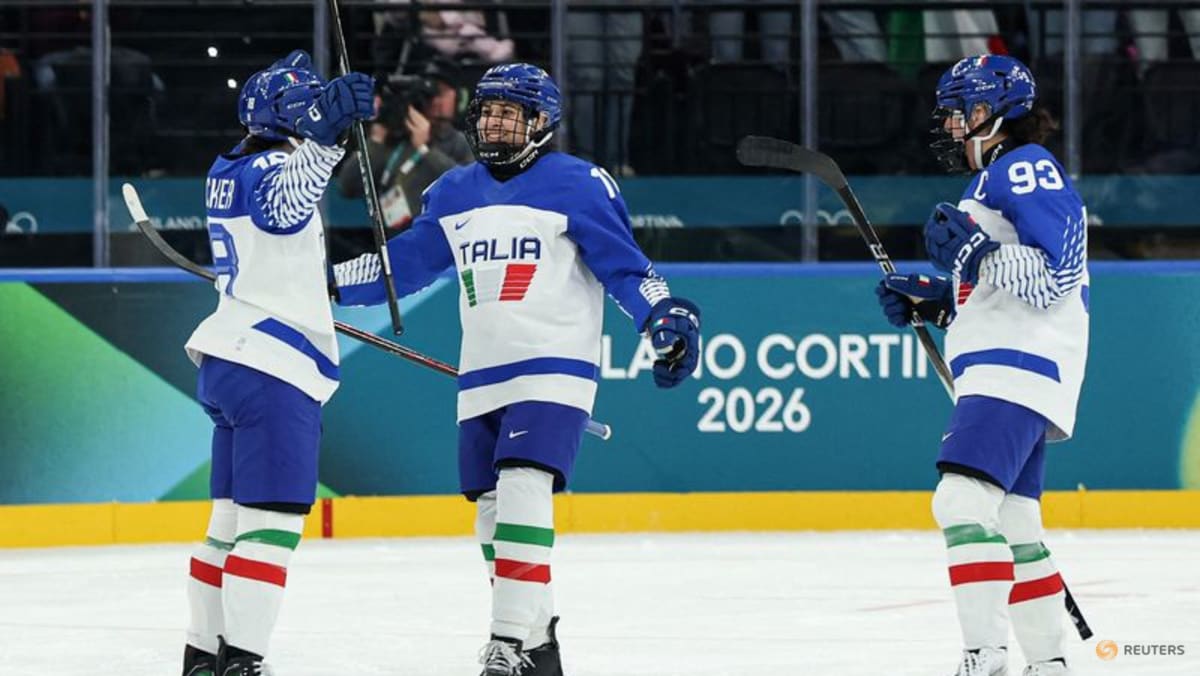 Ice hockey-Italian fans keep party going despite heavy defeat by Sweden