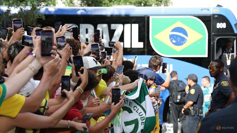 Heat no problem for passionate Brazil fans waiting to greet team in Houston