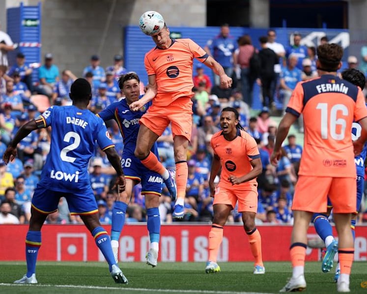 Barcelona march on towards title with 2-0 victory at Getafe