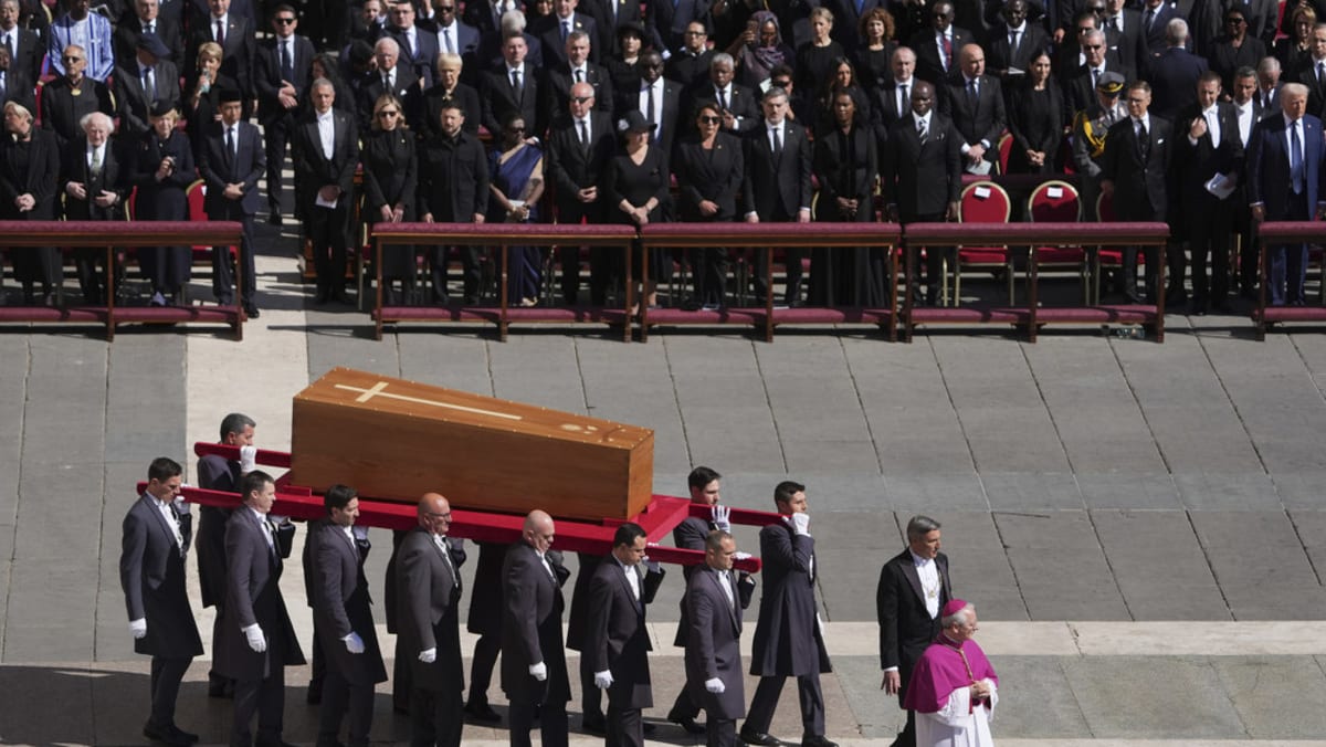 Crowds applaud Pope Francis' coffin as Vatican funeral begins